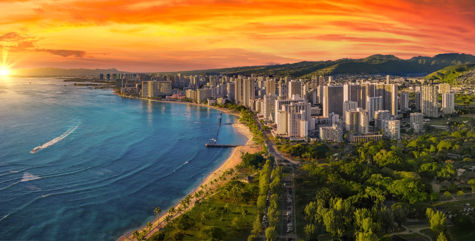 Golden-hour view over the Honolulu skyline toward Waikiki