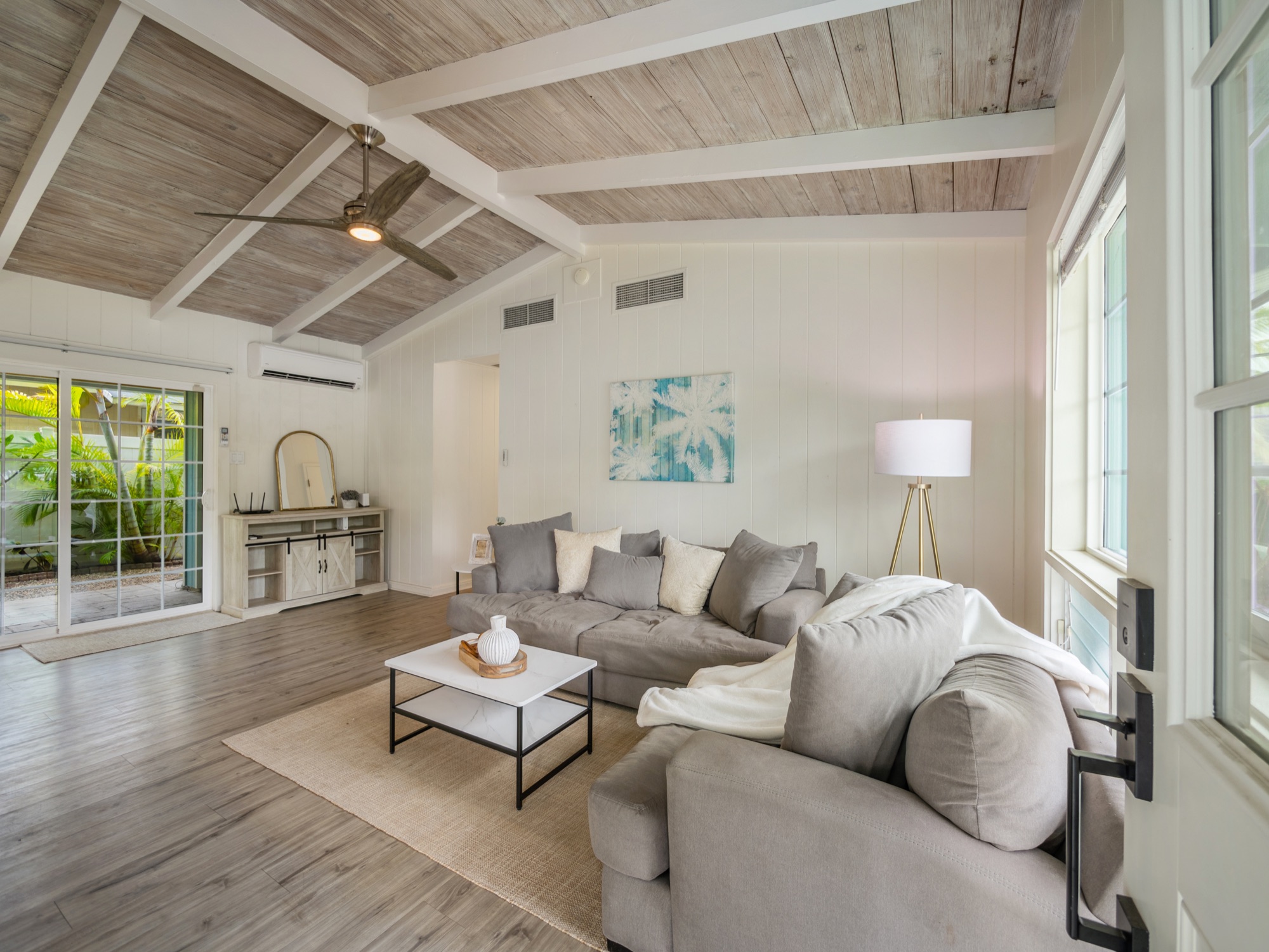 Sunlit, vaulted-ceiling living room of a Kailua home
